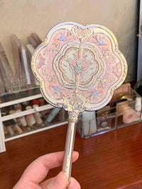 Enchanted Handheld Makeup Mirror for Precise Beauty